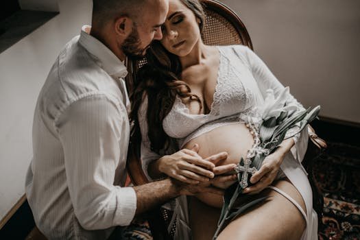 pexels-photo-3369499-3369499 An expecting couple shares a tender moment during a maternity photoshoot at home.