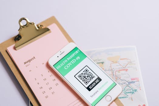 pexels-photo-8372666-8372666 Smartphone with health passport and calendar for organized travel planning.